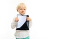 Charming blond child with a tablet with a mockup on a white background Royalty Free Stock Photo