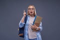 Charming blond girl with documents having good idea Royalty Free Stock Photo