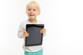 Charming blond kid with a tablet with a mockup on a white background Royalty Free Stock Photo