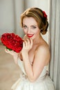 Charming blonde girl with beautiful smile in a white lace dress Royalty Free Stock Photo