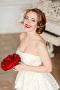 Charming blonde girl with beautiful smile in a white lace dress Royalty Free Stock Photo