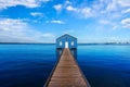 Charming blue boathouse at the end of a pier in Crawley, Western Australia Royalty Free Stock Photo