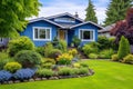 a charming blue home with a lush front yard