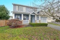 Charming blue two story home with a nice covered porch. Royalty Free Stock Photo