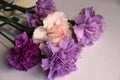 Charming bouquet of multicolored carnations in lilac tones