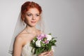 Charming bride with bouquet of flowers