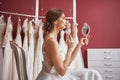 Charming bride in wedding dress doing make-up Royalty Free Stock Photo