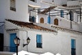 Charming buildings and blue doors and windows in Frigiliana - Spanish white village Andalusia