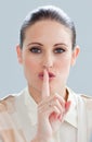Charming businesswoman asking for silence