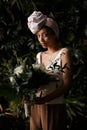 Charming calm curly hair, dark - skinned woman in white