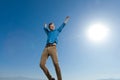 Casual man wearing blue shirt jumping full of life Royalty Free Stock Photo