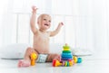 Charming cheerful kid in a diaper laughs Royalty Free Stock Photo