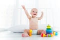 Charming cheerful kid in a diaper laughs Royalty Free Stock Photo