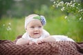 Charming child. Little girl with hat lying on her stomach Royalty Free Stock Photo