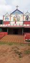 A charming church with statue and pictures in open area