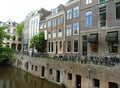 Charming city center with many parking bikes along the canal, Netherlands