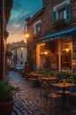 Charming Cobblestone Street with Outdoor Cafe at Sunset Royalty Free Stock Photo