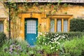 Charming Cotswolds house front with flowers Royalty Free Stock Photo