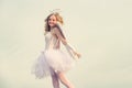 Charming curly little girl in white dress and wings - angel cupid girl. Enjoying magic moment. Angel child girl with