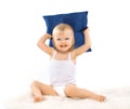 Charming cute little girl with a pillow