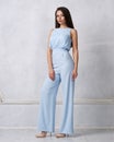 Charming female model in blue jumpsuit