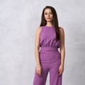 Charming female model in purple jumpsuit