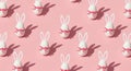 Seamless Pattern of Easter Bunny Eggs with Pink Ribbons on Pastel Pink Background Royalty Free Stock Photo