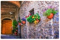 Charming floral decorated streets of medieval towns of Italy. Sp Royalty Free Stock Photo