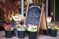 Flower shop sidewalk display with sign Royalty Free Stock Photo