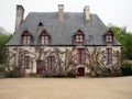 Charming French Cottage Covered in Wisteria Royalty Free Stock Photo