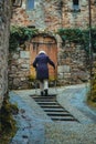 Charming French Stroll: Elderly Women Wander the Cobbled Streets of a Picturesque Village. Royalty Free Stock Photo