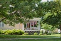 Charming front porch decorated with American flags for Independence Day