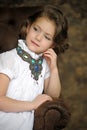 Charming girl child in a white blouse with a beautiful necklace Royalty Free Stock Photo