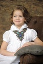 Charming girl child in a white blouse with a beautiful necklace Royalty Free Stock Photo