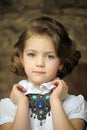 Charming girl child in a white blouse with a beautiful necklace Royalty Free Stock Photo