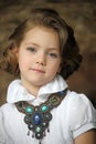 Charming girl child in a white blouse with a beautiful necklace Royalty Free Stock Photo