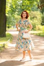 Charming girl with red hair in retro style posing in a vintage dress Royalty Free Stock Photo