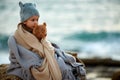 Charming girl with teddy bear cuddling in plaid Royalty Free Stock Photo