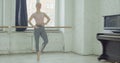 Ballet dancer performing temps lie exercise