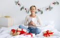 Happy lady celebrating Christmas wrapping gift box Royalty Free Stock Photo