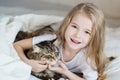 Charming happy little girl hugging her cat Royalty Free Stock Photo