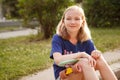 Cute young girl with pennyboard outdoors Royalty Free Stock Photo