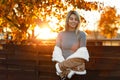 Charming happy young woman in a gray trendy vintage knitted