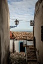 Charming Italian streetlantern hanging on a wall with Stunning View of the blue skies in Rocca Imperiale Royalty Free Stock Photo