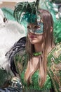 Charming italian woman in Venetian green costume mask dress Royalty Free Stock Photo