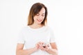 Charming joyful girl is reading pleasant text message on mobile phone from her boyfriend during her rest time. Smiling woman Royalty Free Stock Photo