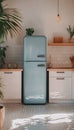 Charming kitchen interior with a vintage blue refrigerator, white cabinets, and modern decor. Royalty Free Stock Photo