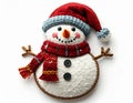 Charming Knitted Snowman Decoration with Red Hat and Scarf on White Backdrop Royalty Free Stock Photo