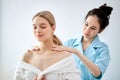 Charming Lady Getting Neck Massage In Beauty Spa. Caucasian Female Relaxing In Spa Royalty Free Stock Photo