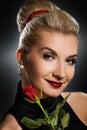 Charming lady with red rose Royalty Free Stock Photo